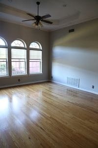 empty room featuring light hardwood / wood-style flooring, ceiling fan, and plenty of natural light