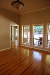 unfurnished room with wood-type flooring and crown molding