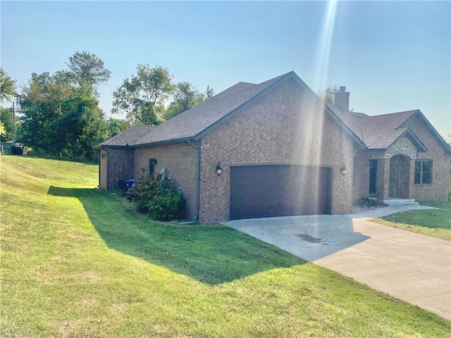 view of home's exterior with a yard and a garage