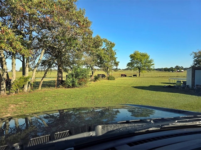 view of yard with a rural view