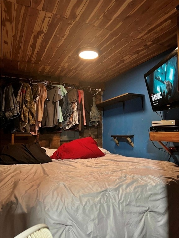 bedroom featuring wood ceiling and lofted ceiling