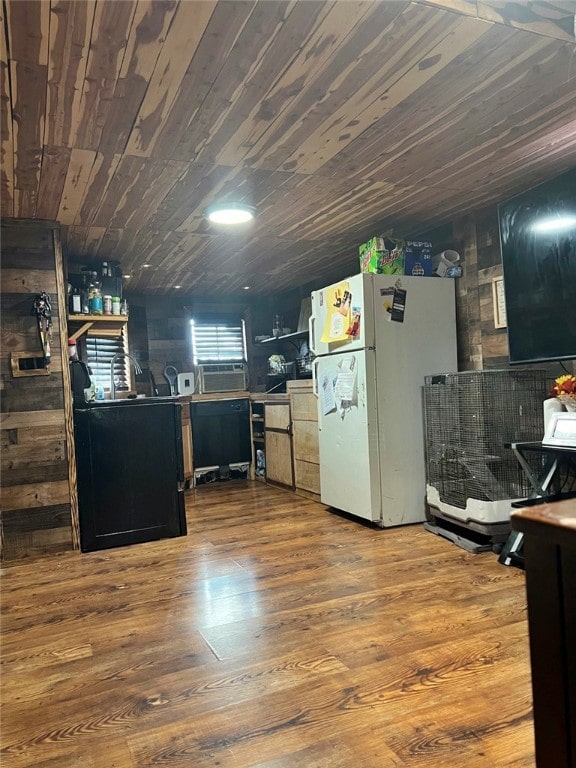 kitchen featuring wood-type flooring, wood ceiling, and white fridge