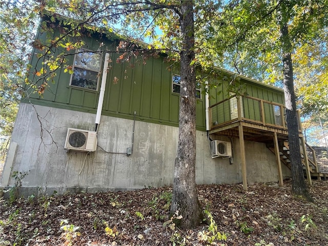 view of side of property with ac unit