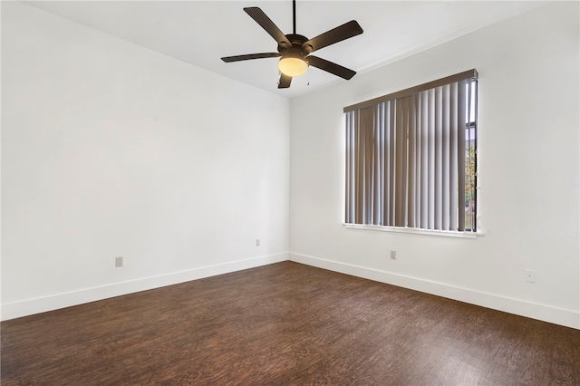 empty room with dark wood-type flooring and ceiling fan