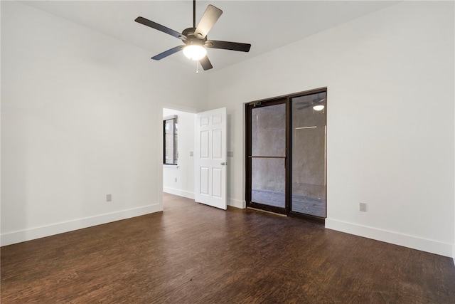 empty room featuring dark hardwood / wood-style floors and ceiling fan