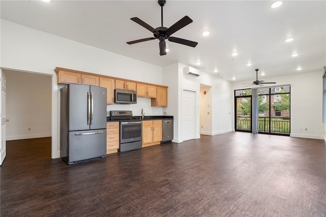 kitchen featuring appliances with stainless steel finishes, sink, dark wood-type flooring, and ceiling fan