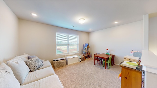 game room featuring light colored carpet