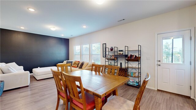 dining space featuring light hardwood / wood-style flooring