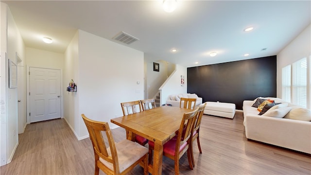 dining room featuring light hardwood / wood-style flooring