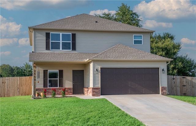 view of front of home featuring a garage and a front yard