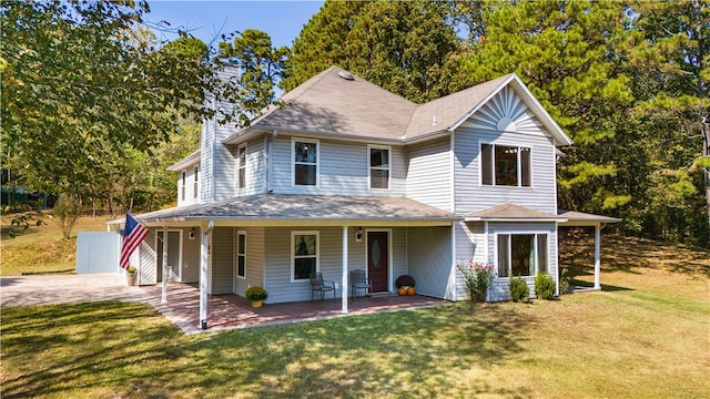 view of front of house with a front yard and a chimney