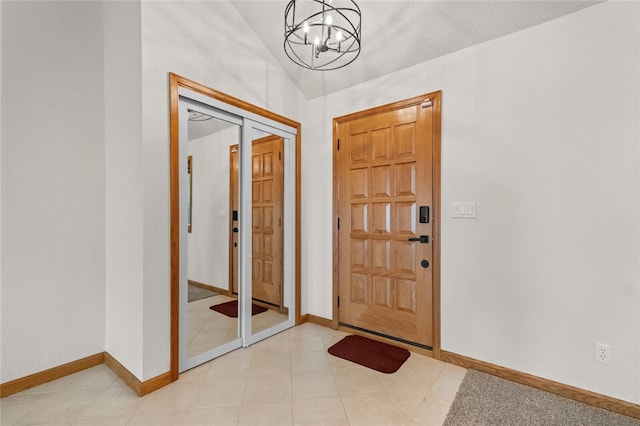 entrance foyer featuring an inviting chandelier