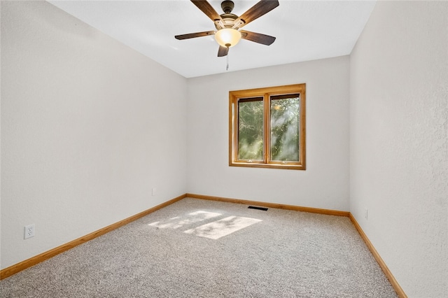 unfurnished room with carpet floors and ceiling fan