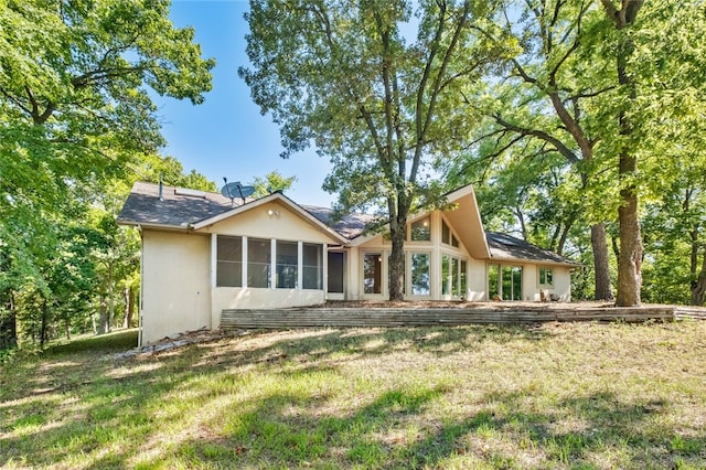 back of house with a yard