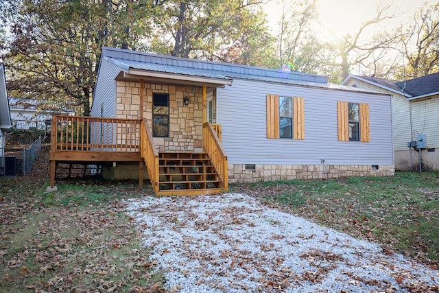 view of front of house with a wooden deck