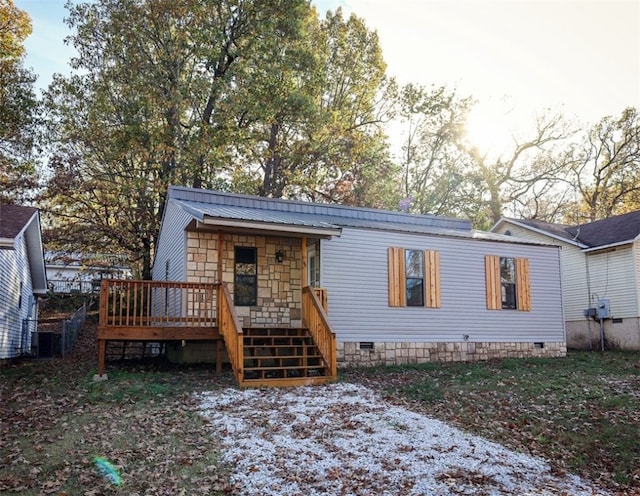 view of front of house with a wooden deck