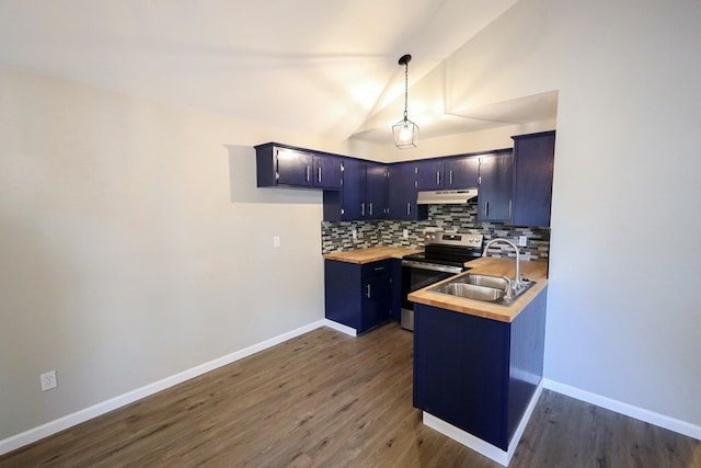 kitchen featuring dark wood-type flooring, hanging light fixtures, vaulted ceiling, tasteful backsplash, and butcher block countertops