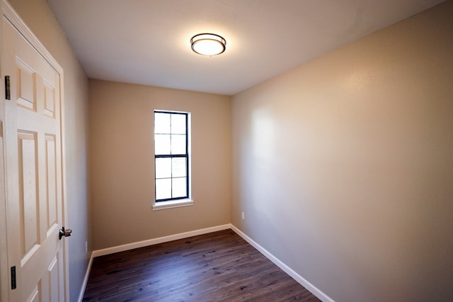 empty room with dark wood-type flooring