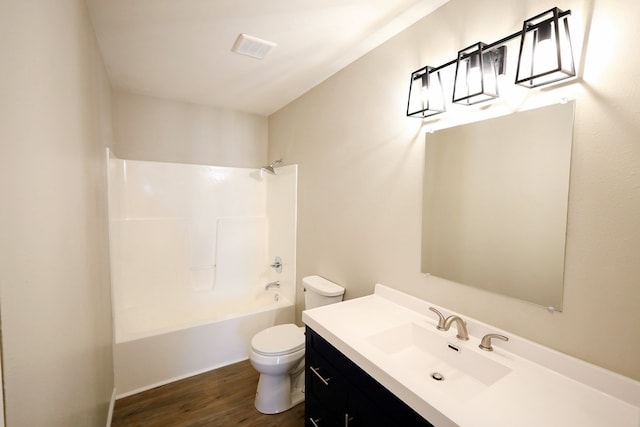 full bathroom with vanity, toilet, shower / bathing tub combination, and hardwood / wood-style flooring