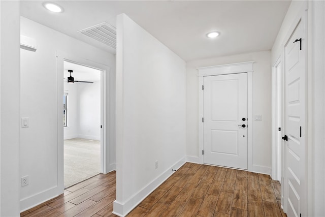 corridor featuring hardwood / wood-style floors