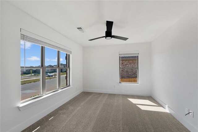 4206 SW Adams St, Bentonville, AR 72713 - carpeted spare room with ceiling fan and baseboards