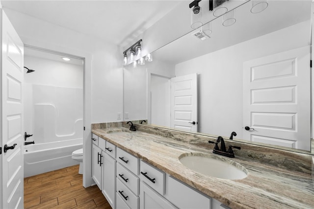 4206 SW Adams St, Bentonville, AR 72713 - full bath featuring toilet, double vanity, wood finished floors, and shower / bathtub combination