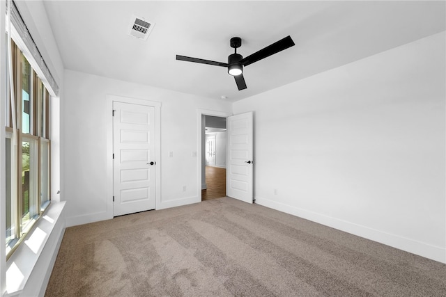 4206 SW Adams St, Bentonville, AR 72713 - unfurnished bedroom with carpet, baseboards, and a ceiling fan