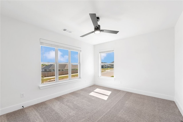 empty room with carpet flooring and ceiling fan