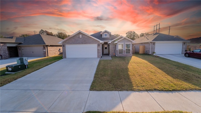 view of front facade featuring a yard and a garage