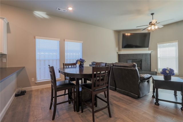 dining room featuring ceiling fan and dark hardwood / wood-style floors