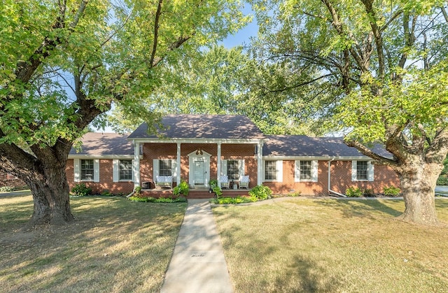 view of front of home with a porch and a front lawn