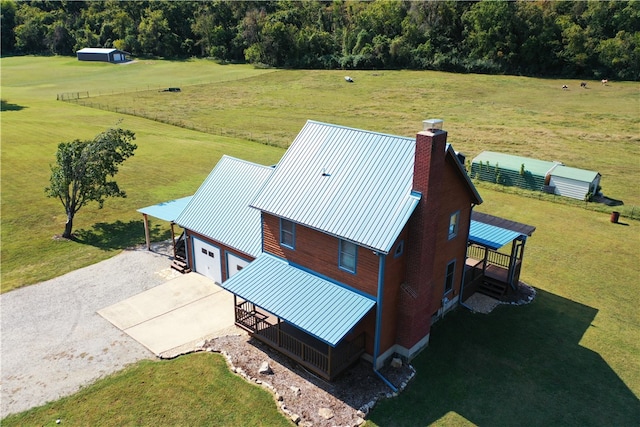 birds eye view of property featuring a rural view