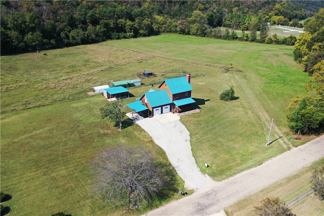 birds eye view of property with a rural view