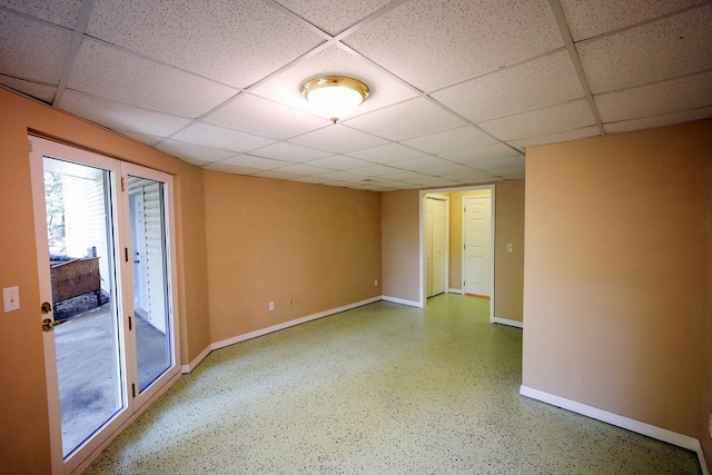 unfurnished room with a paneled ceiling