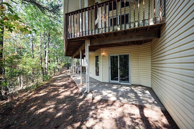 view of patio featuring a balcony