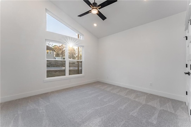 carpeted empty room with ceiling fan, baseboards, vaulted ceiling, and recessed lighting