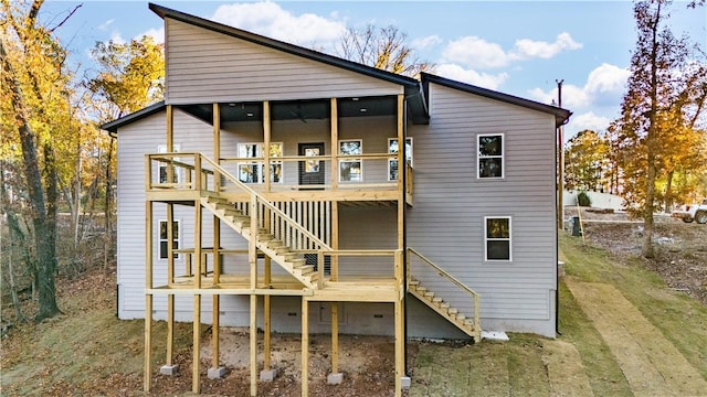 rear view of house with a yard