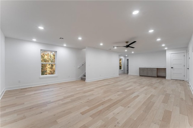 unfurnished living room featuring visible vents, light wood-style floors, a ceiling fan, and recessed lighting