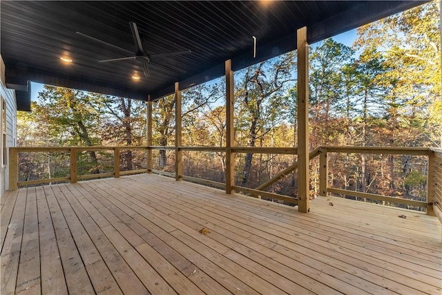 wooden deck featuring ceiling fan