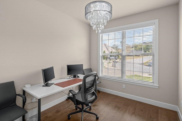 office with an inviting chandelier and hardwood / wood-style floors