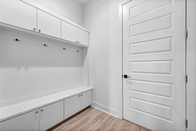 mudroom with light hardwood / wood-style flooring