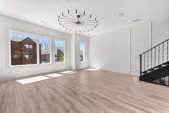 unfurnished living room featuring light hardwood / wood-style floors