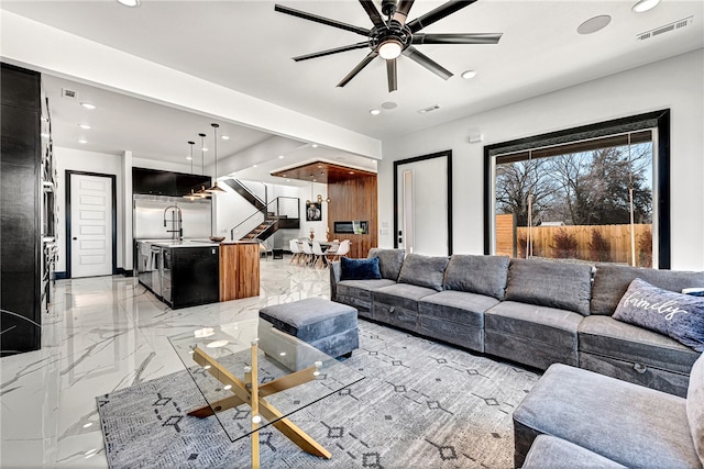 living room featuring ceiling fan