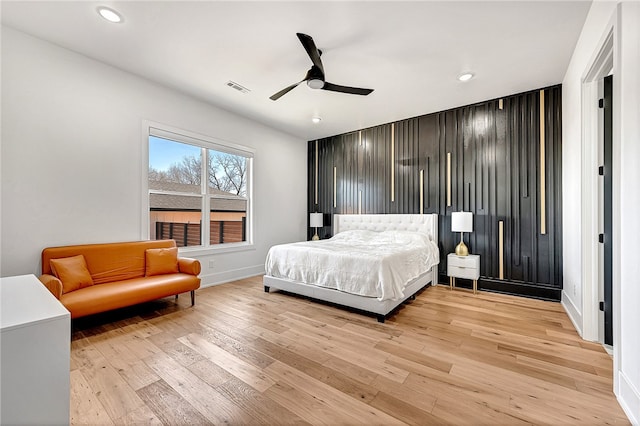 bedroom featuring light wood-type flooring and ceiling fan