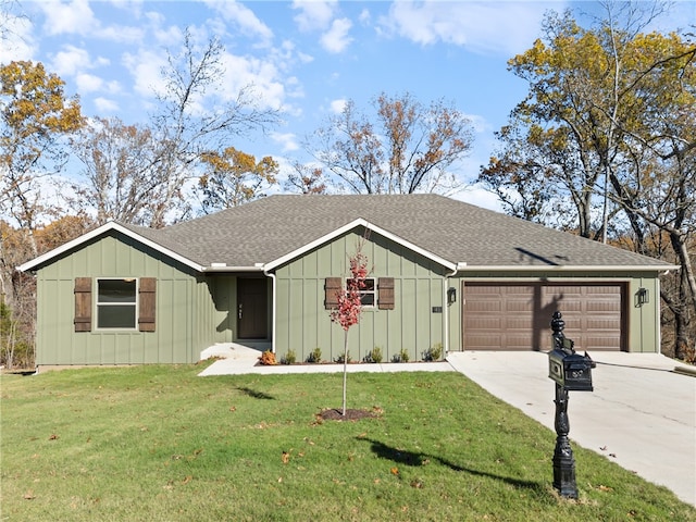 ranch-style house featuring a garage and a front lawn