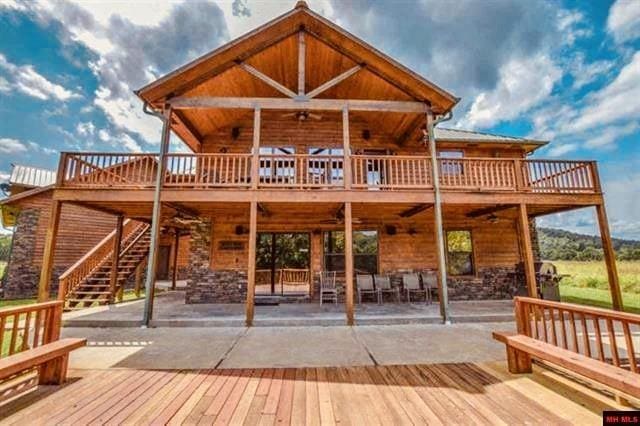 471 Mcphearson Ter, Calico Rock, AR 72519 - back of property with stairway, a wooden deck, a ceiling fan, and a patio area