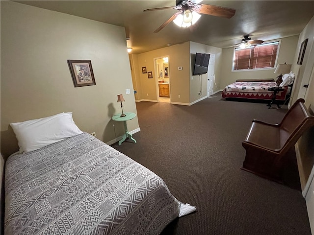 carpeted bedroom featuring connected bathroom and ceiling fan