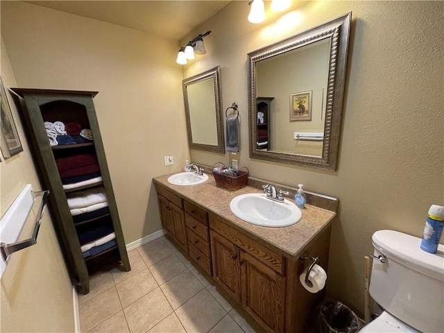 471 Mcphearson Ter, Calico Rock, AR 72519 - full bathroom with double vanity, toilet, tile patterned flooring, and a sink