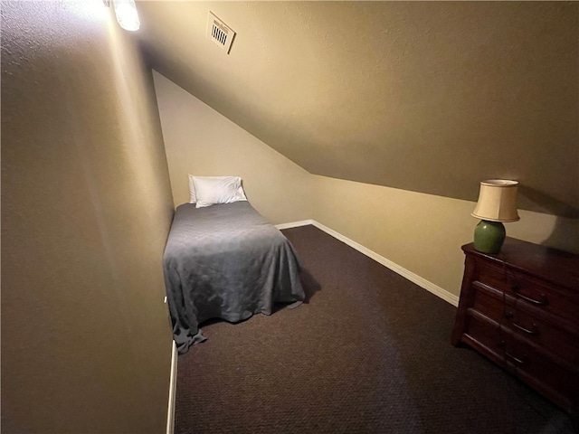 carpeted bedroom featuring vaulted ceiling