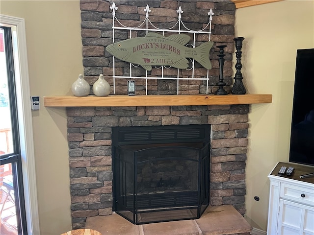 details featuring a stone fireplace